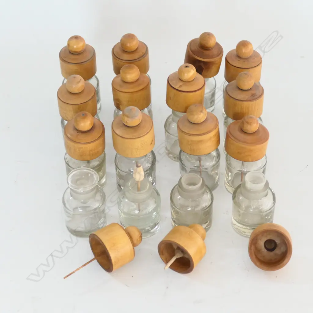 15 SMALL GLASS BOTTLES WITH INSET GROUND GLASS MOUTHS AND TURNED BOXWOOD COVERS Image 1++